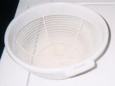 white plastic colander