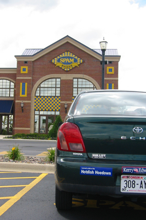 Car with Hotdish Hoedown sticker parked in front of Spam Museum in Austin, Minnesota.